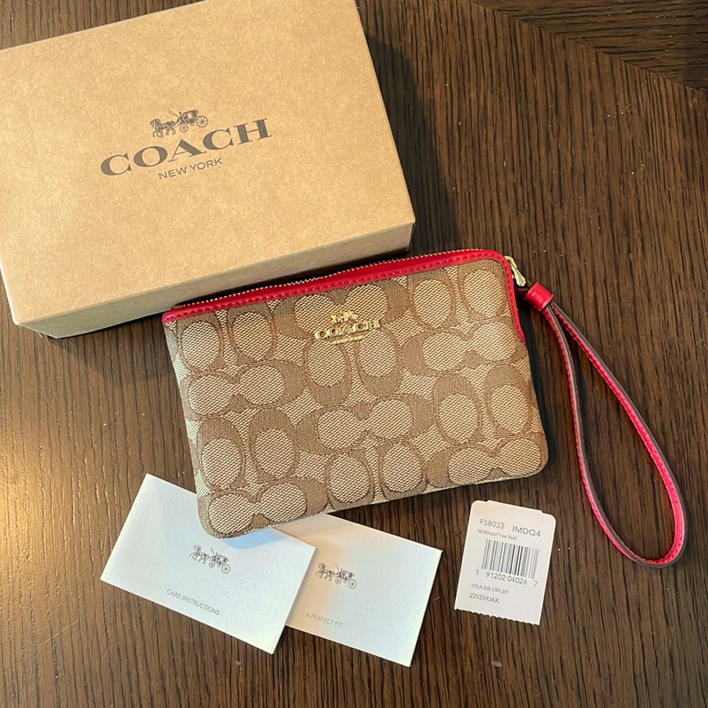 BRAND NEW W Tags and Box; COACH wristlet with red detailing. Never used.